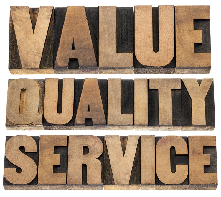 value, quality, service- business mantra concept - isolated words in vintage letterpress wood type printing blocks