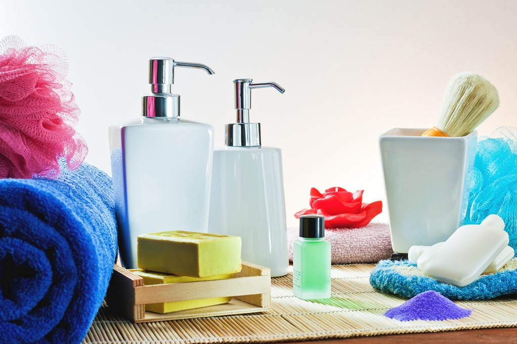 aromatherapy and spa still life: towel, soap, candles, sponges, perfume and shaving brush,