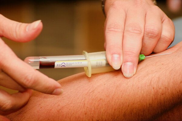 man taking injection