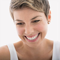 Close up of smiling blonde woman looking down